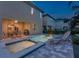 Exterior of a patio with a pool and a jacuzzi surrounded by lounge chairs and a house at 7568 Marker Ave, Kissimmee, FL 34747