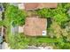 Aerial view of a charming home with a well-maintained roof, lush landscaping, and a private backyard at 769 Dunlap Cir, Winter Springs, FL 32708