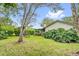 A lush backyard with a well-maintained lawn and landscaping offering a serene and private setting at 769 Dunlap Cir, Winter Springs, FL 32708