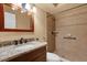 Bathroom featuring a granite countertop vanity and tiled walk-in shower at 769 Dunlap Cir, Winter Springs, FL 32708