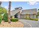 Attractive home exterior with a modern roof, stone accents, and manicured landscaping at 769 Dunlap Cir, Winter Springs, FL 32708