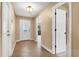 Inviting foyer with tile flooring, a decorative front door, and views into the home at 769 Dunlap Cir, Winter Springs, FL 32708