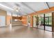 Open concept living and kitchen area with tile flooring and sliding doors to the outdoor space at 769 Dunlap Cir, Winter Springs, FL 32708