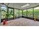 Enclosed patio with tile flooring, skylight, and screens, providing a relaxing indoor-outdoor space at 769 Dunlap Cir, Winter Springs, FL 32708