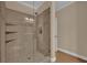 Shower room includes a glass enclosure and tiled walls with a small bench at 911 N Orange Ave # 104, Orlando, FL 32801