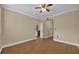 Bedroom features include wood-look tile flooring, ceiling fan and adjoining spaces at 911 N Orange Ave # 104, Orlando, FL 32801