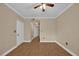 Bedroom with wood-look tile, doors leading to closet and hallway at 911 N Orange Ave # 104, Orlando, FL 32801