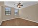 This cozy bedroom features beautiful wood-look floors and plenty of natural light from the two bright windows at 911 N Orange Ave # 104, Orlando, FL 32801