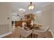 Open-concept dining area with view into the kitchen and access to other rooms. Seating for four at 911 N Orange Ave # 104, Orlando, FL 32801