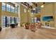 Cozy living room with comfortable chairs, a small dining table and large windows for natural light at 911 N Orange Ave # 104, Orlando, FL 32801