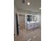 Stylish bathroom showcasing a double vanity, modern lighting, and tiled floor at 917 Swallow St, Deltona, FL 32725