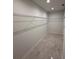 Walk-in closet with wire shelving and tile flooring at 917 Swallow St, Deltona, FL 32725