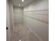 Walk-in closet with hard surface floors and shelving at 917 Swallow St, Deltona, FL 32725