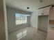 Cozy dining room with modern light fixture and window with view of the yard at 917 Swallow St, Deltona, FL 32725