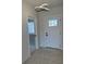 A bright foyer with neutral walls and a modern light fixture creates a welcoming entrance at 917 Swallow St, Deltona, FL 32725