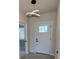 Well-lit foyer features a modern light fixture and access to other rooms at 917 Swallow St, Deltona, FL 32725