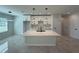 Open island kitchen features stainless steel sink and modern lighting at 917 Swallow St, Deltona, FL 32725