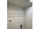 Laundry room with a shelf for storage at 917 Swallow St, Deltona, FL 32725