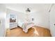 Bedroom featuring hard wood floors, a bed, and a window at 10236 Chorlton Cir, Orlando, FL 32832