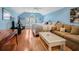 Bedroom with hardwood floors, comfortable seating, and an abundance of natural light from the windows at 10411 Hart Branch Cir, Orlando, FL 32832