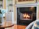 Close-up of the fireplace with a granite surround and built-in shelving at 10411 Hart Branch Cir, Orlando, FL 32832