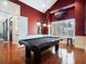 Game room with vaulted ceiling, recessed lighting, pool table, sofa, and stool at 10411 Hart Branch Cir, Orlando, FL 32832