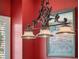 Close up of a lighting fixture over the pool table in the game room at 10411 Hart Branch Cir, Orlando, FL 32832