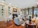 Spacious living room featuring a cozy fireplace and comfortable seating at 10411 Hart Branch Cir, Orlando, FL 32832