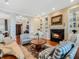 Bright living room with fireplace, piano, and comfortable seating area at 10411 Hart Branch Cir, Orlando, FL 32832