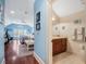 Spacious main bedroom with an en-suite bathroom, hardwood floors, and a cozy sitting area at 10411 Hart Branch Cir, Orlando, FL 32832