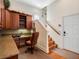 Office space with custom cabinetry, a built-in desk, and stairs leading to the upper level at 10411 Hart Branch Cir, Orlando, FL 32832