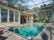 Gorgeous in-ground swimming pool with screened enclosure, offering a private and serene outdoor experience at 10411 Hart Branch Cir, Orlando, FL 32832