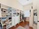 A large walk-in closet featuring built-in shelving and drawers, providing ample storage space at 10411 Hart Branch Cir, Orlando, FL 32832