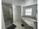 Bathroom features a soaking tub with tile surround, separate shower, and linen closet at 11137 Lore Way, Orlando, FL 32832