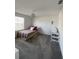 Bedroom with neutral walls, striped bedspread, and modern light fixture at 11137 Lore Way, Orlando, FL 32832