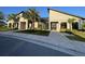 Stylish clubhouse with modern architectural details, lush landscaping, and inviting entrance at 11137 Lore Way, Orlando, FL 32832