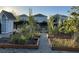 Community garden with raised beds and mature plants at 11137 Lore Way, Orlando, FL 32832