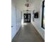 Hallway featuring luxury tile floors and modern lighting at 11137 Lore Way, Orlando, FL 32832