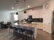Modern kitchen with a large center island, sleek countertops, and stainless steel appliances for a chef's delight at 11137 Lore Way, Orlando, FL 32832