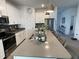 Spacious kitchen with island, stainless steel appliances, and modern finishes, perfect for cooking and entertaining at 11137 Lore Way, Orlando, FL 32832
