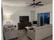 Living room with a ceiling fan, television, and comfortable seating arrangement at 11137 Lore Way, Orlando, FL 32832
