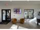Modern lobby with comfortable seating, television, and view to outside area at 11137 Lore Way, Orlando, FL 32832