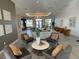 Inviting lounge area featuring comfortable seating, a decorative center table, and ample natural light from large windows at 11137 Lore Way, Orlando, FL 32832