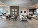 Spacious lounge area with comfortable seating, stylish decor, and a well-appointed kitchenette, perfect for relaxation at 11137 Lore Way, Orlando, FL 32832
