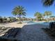 Community pool with inviting lounge chairs and umbrellas for a relaxing experience at 11137 Lore Way, Orlando, FL 32832
