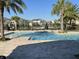 Community pool area with lounge chairs and palm trees at 11137 Lore Way, Orlando, FL 32832