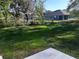 View of a spacious backyard featuring lush grass and a chain-link fence at 12793 Sw 43Rd Cir, Ocala, FL 34473