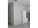 Hallway with white walls and light wood flooring at 12793 Sw 43Rd Cir, Ocala, FL 34473