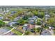 Aerial view of home with a pool, surrounded by trees and other homes in a suburban neighborhood at 1306 Pleasantridge Pl, Orlando, FL 32835