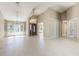 Inviting foyer featuring tiled flooring, a high ceiling, stylish chandelier, and large windows at 1306 Pleasantridge Pl, Orlando, FL 32835